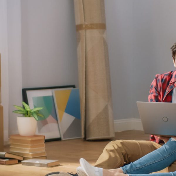 A couple reviewing a move on a laptop